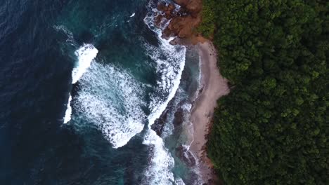 Aerial-drone-shot-over-coast-waves-in-martinique